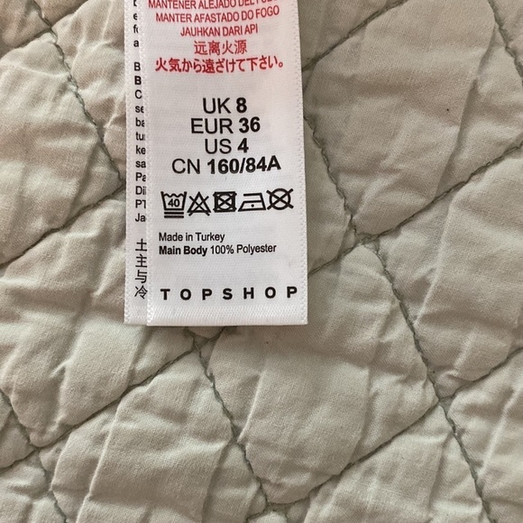 TOPSHOP top, black with floral green and rose Asymmetrical ruffles front to back - Picture 7 of 7